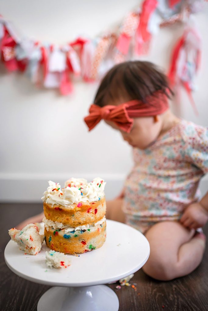 funfetti smash cake with baby girl