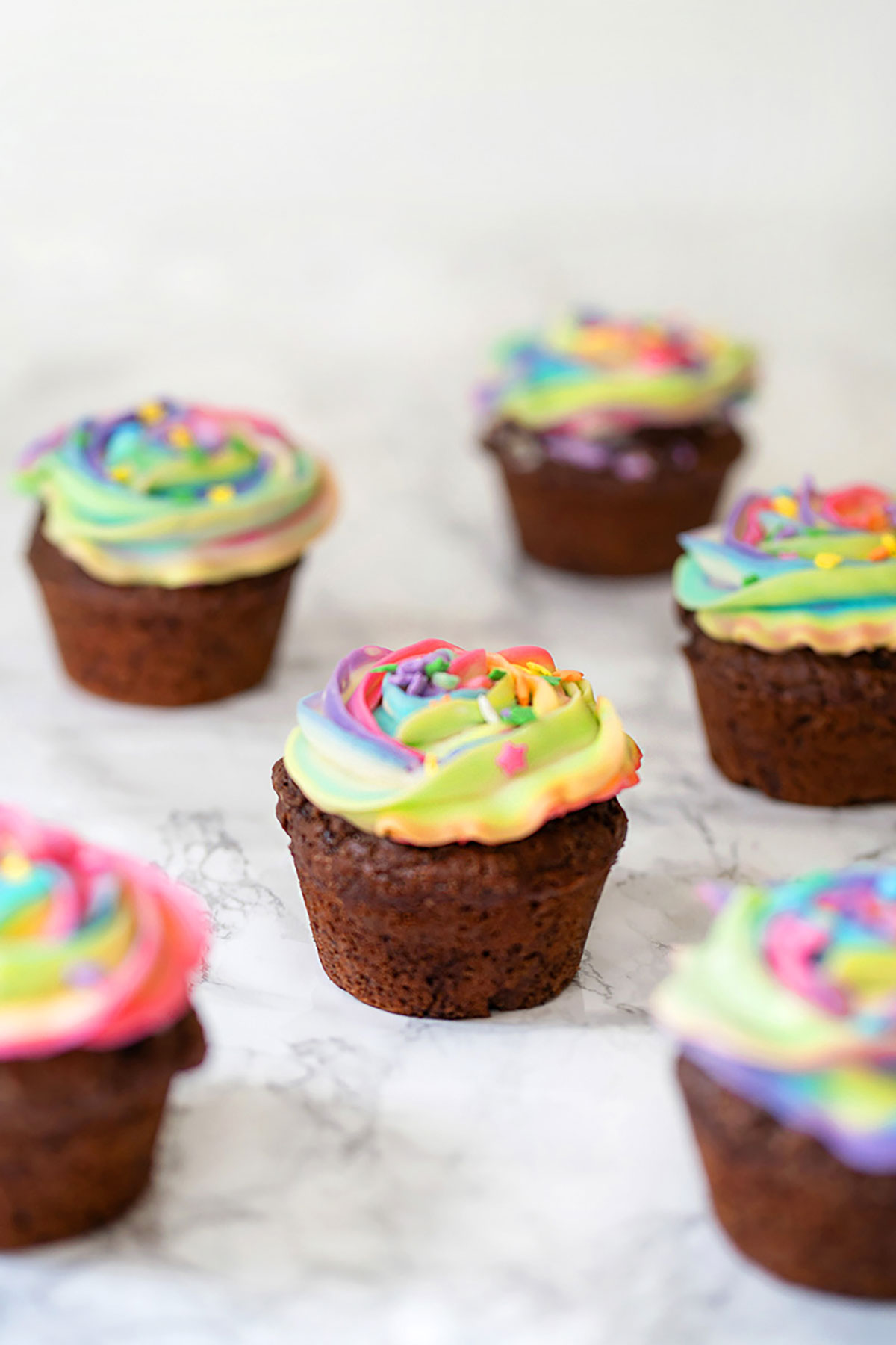 rainbow frosting chocolate cupcake close up